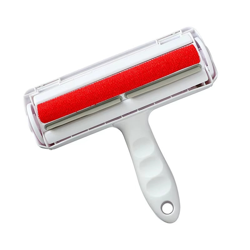 White pet hair removal roller with red roller on a white background